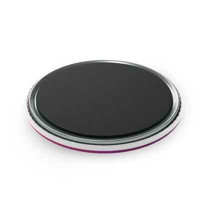 Black circular object with metallic rim on a white background