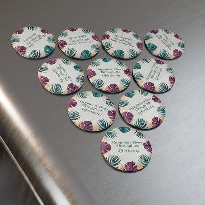 Set of round pins with floral design and text on a metallic surface