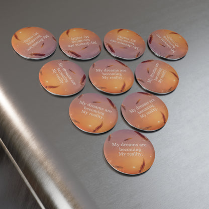 Circular magnets with motivational quote on a metallic surface