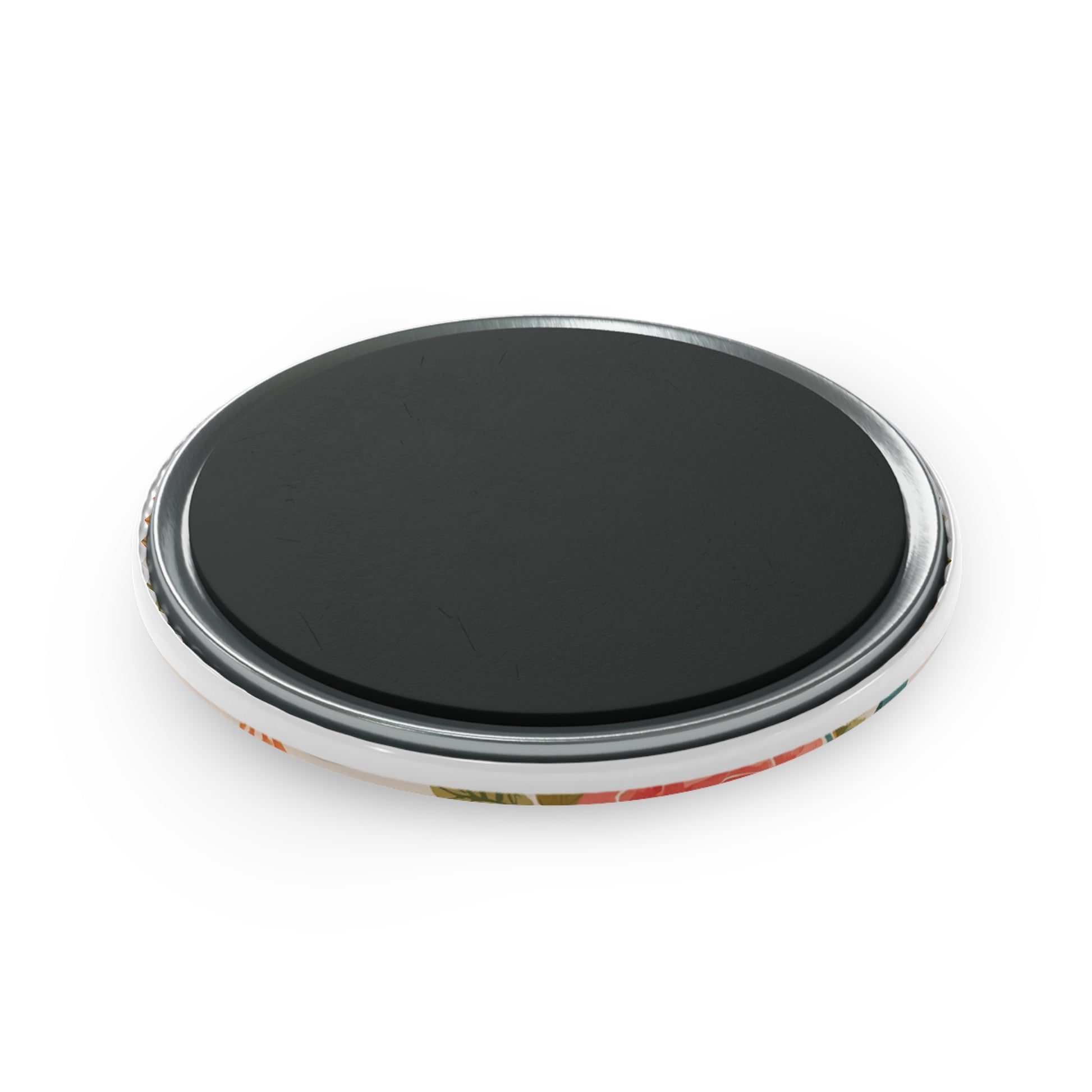 Round black object with metallic rim on a white background