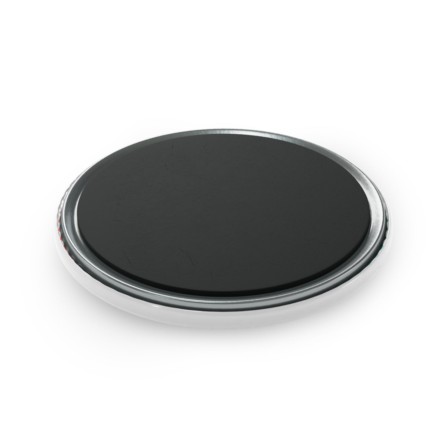 Black circular object with chrome rim on a white background