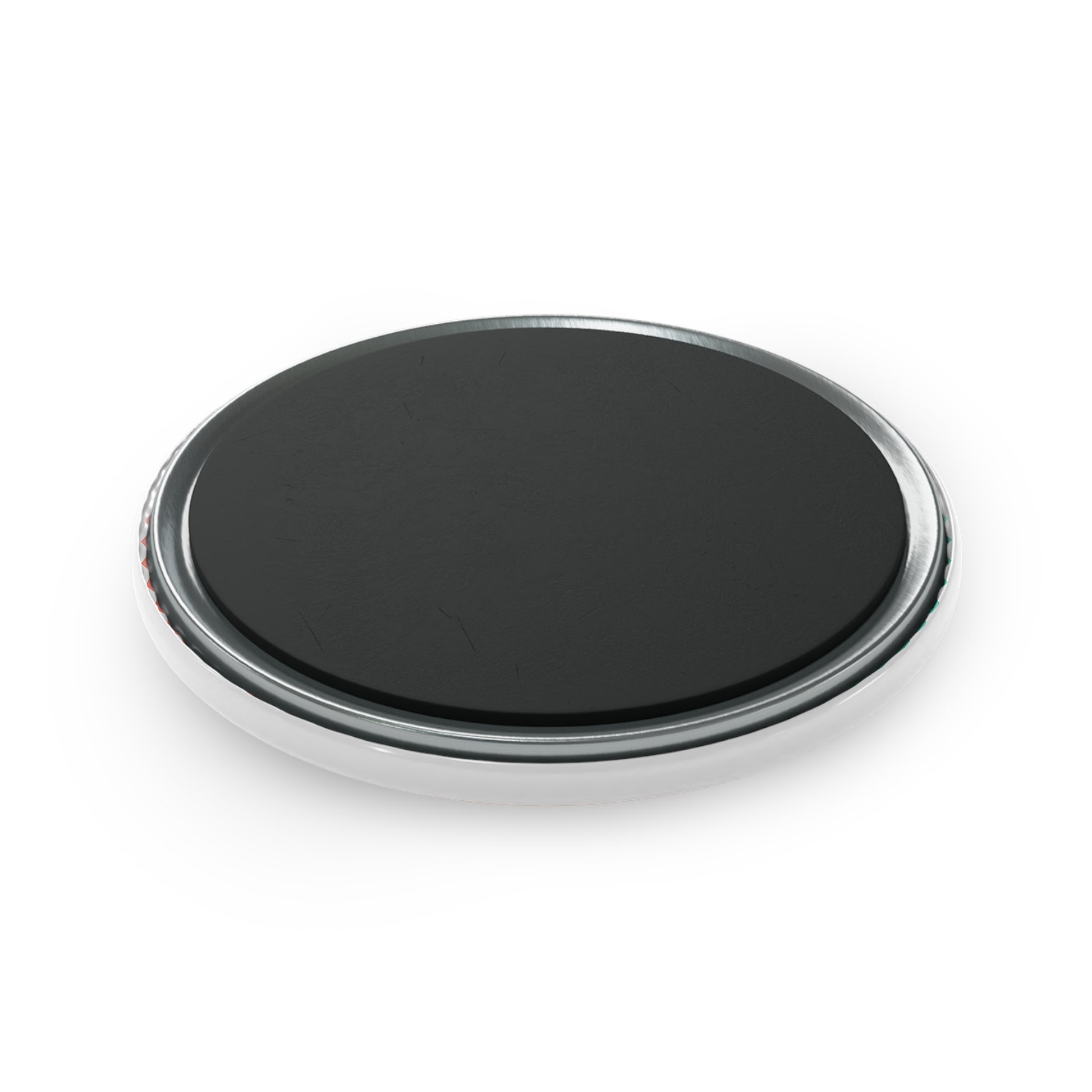 Black circular object with chrome rim on a white background