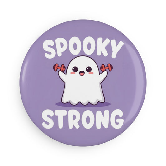 Button badge with a ghost lifting weights and 'Spooky Strong' text on a purple background